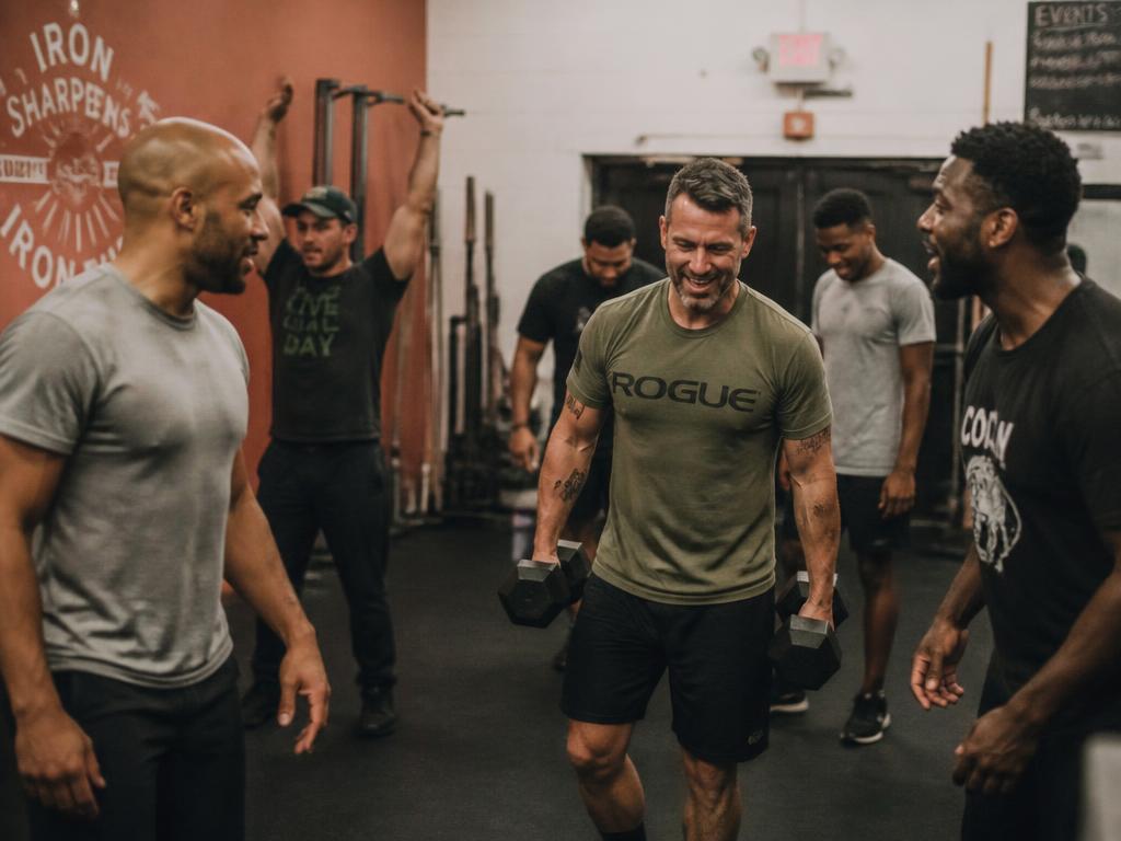 Men working out together in the community gym space